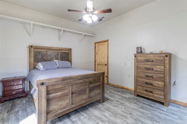 bedroom featuring wood-type flooring and ceiling fan