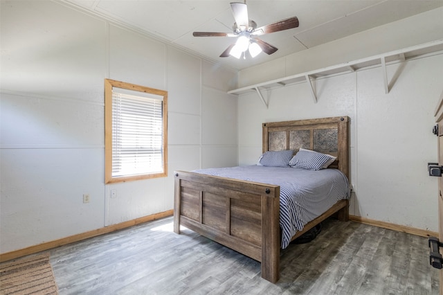 bedroom featuring ceiling fan and wood-type flooring