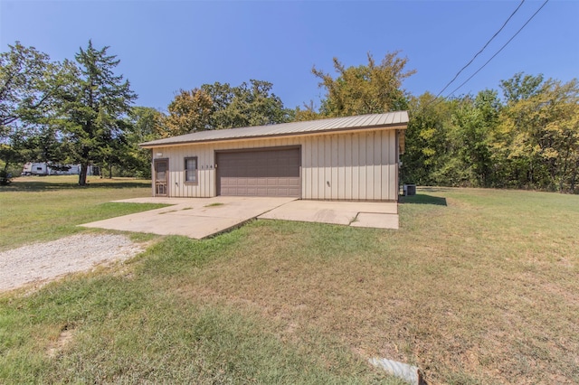 garage featuring a yard