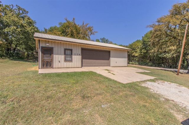 garage featuring a yard