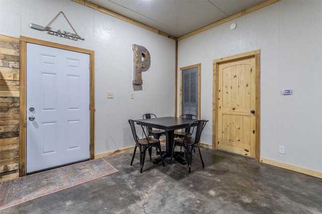 dining area featuring concrete floors