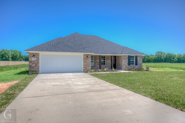 ranch-style home with a front yard and a garage