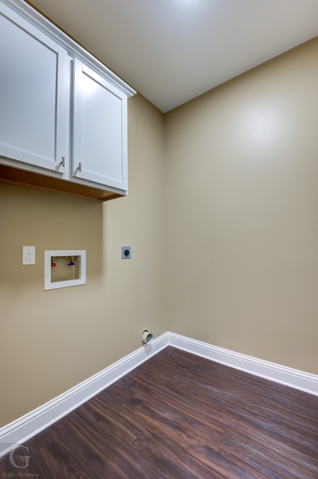 laundry room with hookup for a washing machine, cabinets, hardwood / wood-style flooring, and electric dryer hookup