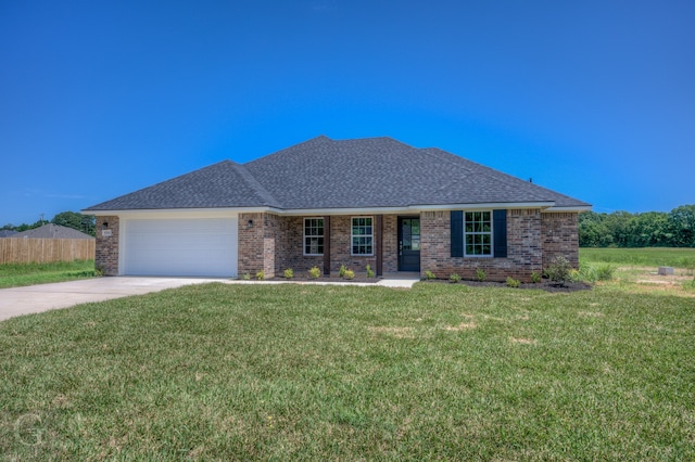 ranch-style home featuring a front lawn and a garage