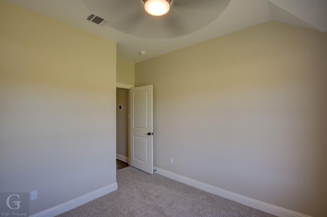 empty room featuring light carpet