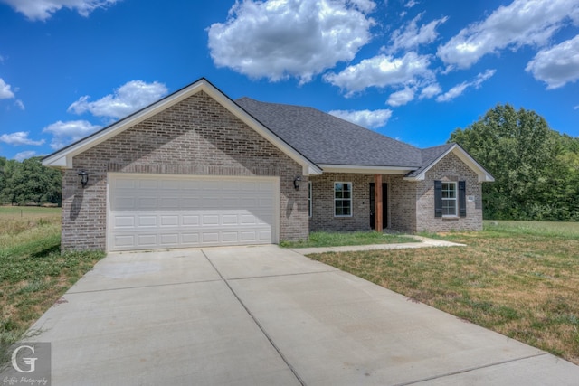 ranch-style home with a front yard and a garage