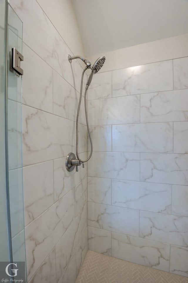 bathroom with tiled shower