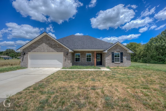 ranch-style home featuring a front yard and a garage