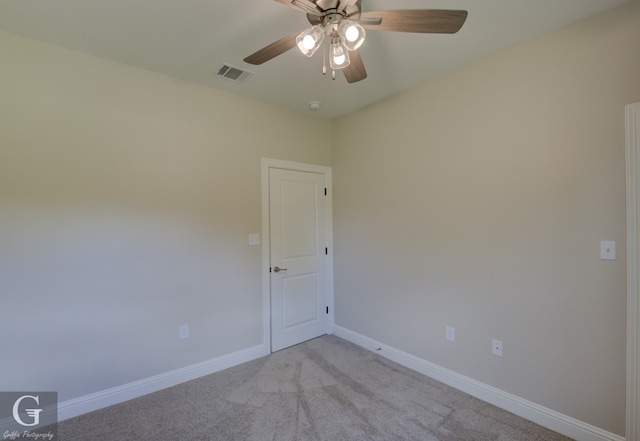 unfurnished room with ceiling fan and light colored carpet