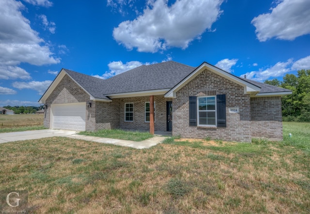 ranch-style home with a front yard and a garage