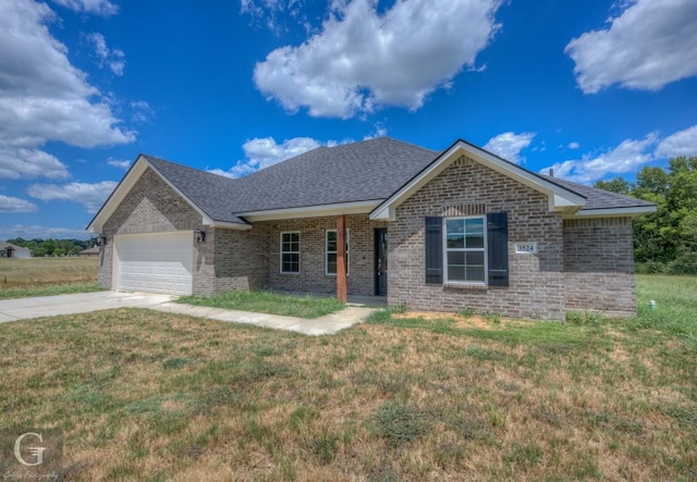 ranch-style house featuring a garage and a front yard