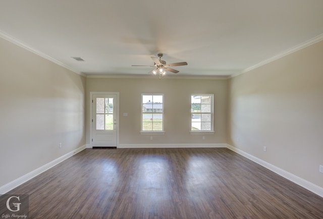 spare room with ornamental molding, dark hardwood / wood-style flooring, and ceiling fan