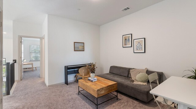 living room with light colored carpet