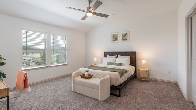 bedroom with carpet floors, ceiling fan, and vaulted ceiling