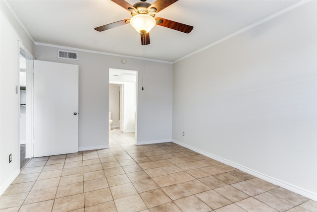 unfurnished room with light tile patterned flooring, crown molding, and ceiling fan