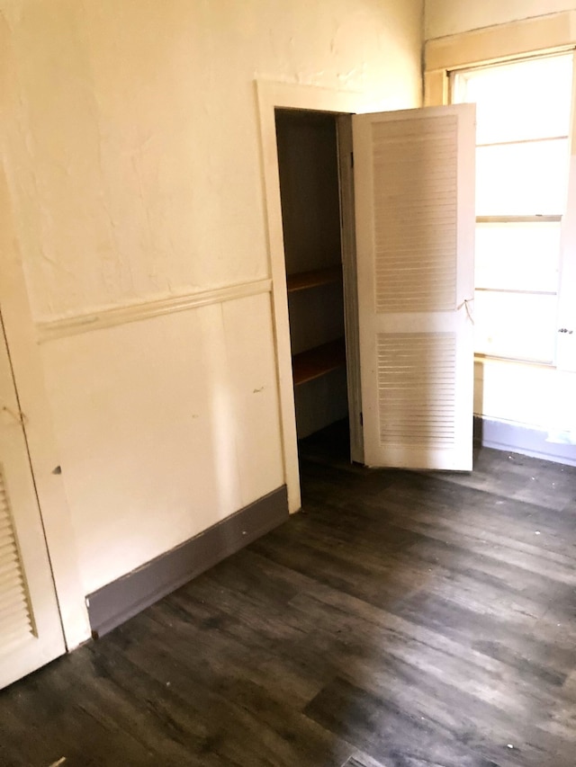 spare room featuring dark hardwood / wood-style flooring