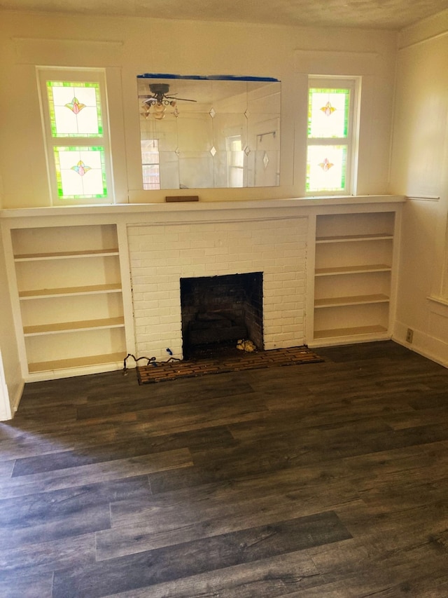 living room with ceiling fan, dark hardwood / wood-style flooring, and a fireplace