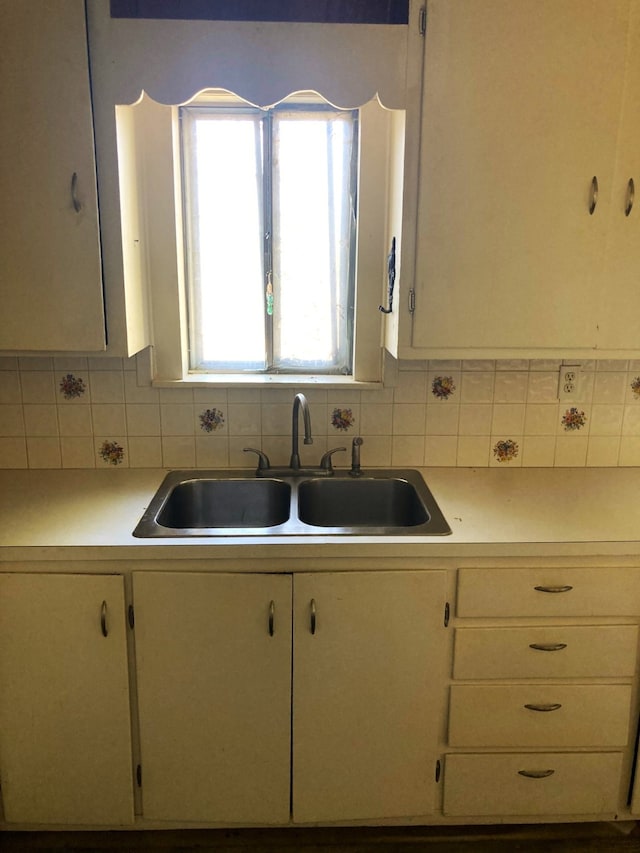 kitchen with sink and tasteful backsplash