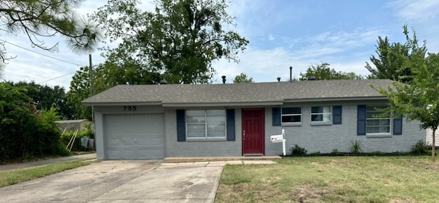 single story home featuring a front yard and a garage