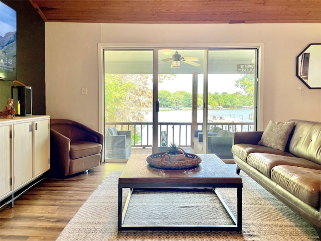 living room featuring light hardwood / wood-style floors and ceiling fan