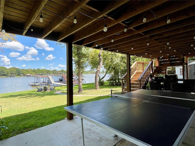 view of patio / terrace with a boat dock and a water view