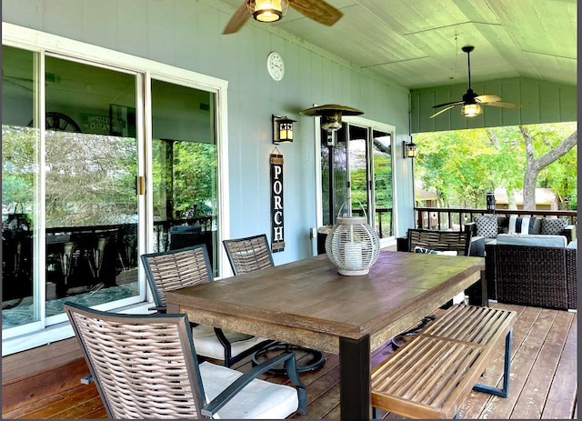 exterior space with lofted ceiling and a ceiling fan