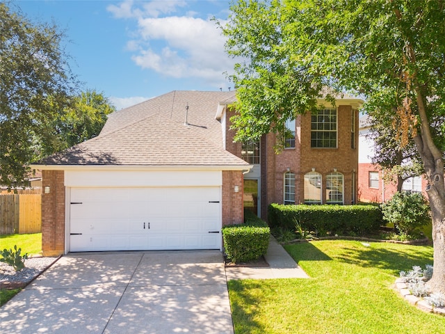 view of front facade with a garage and a front yard