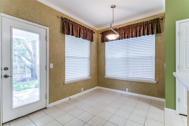 unfurnished dining area featuring light tile patterned floors and ornamental molding