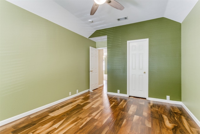 unfurnished bedroom featuring wood-type flooring, ceiling fan, and lofted ceiling