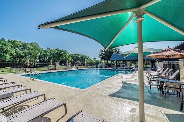 view of swimming pool with a patio area