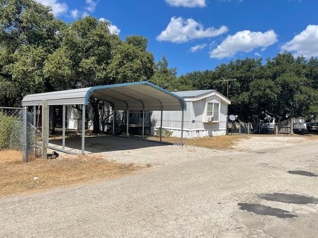 exterior space with a carport