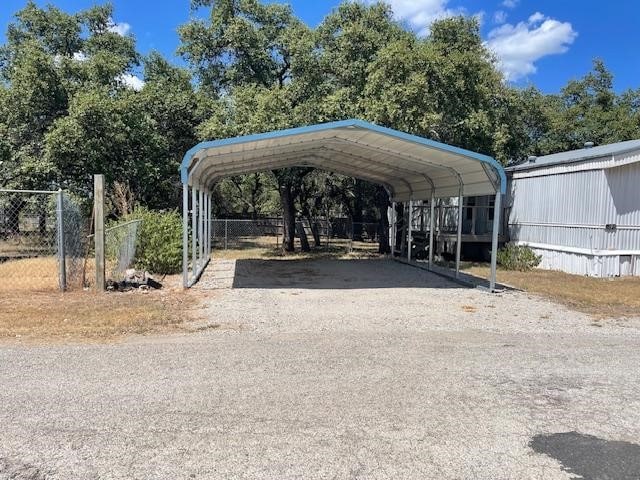 view of vehicle parking featuring a carport