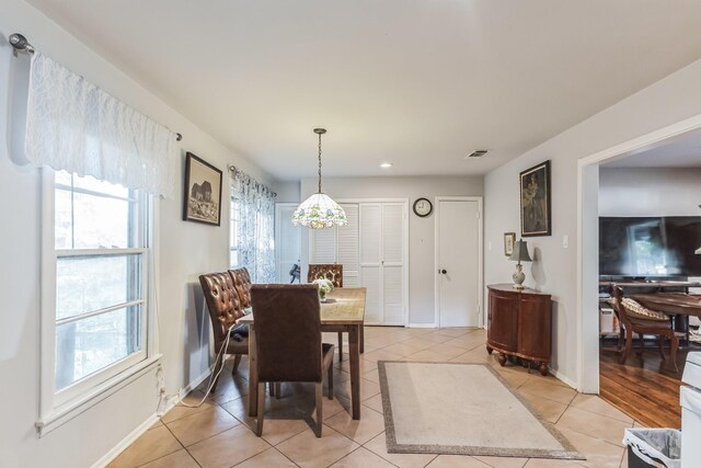 dining room featuring light tile patterned flooring