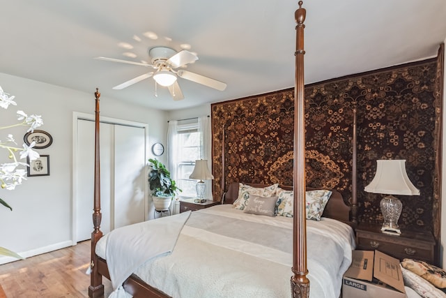 bedroom with ceiling fan and wood-type flooring