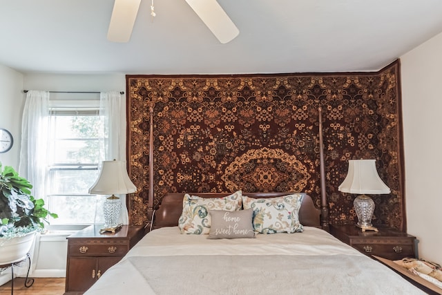 bedroom featuring ceiling fan and wood-type flooring