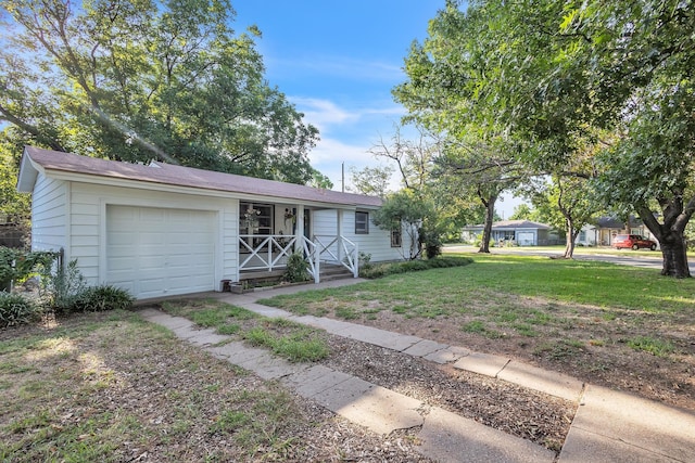 ranch-style house featuring a garage and a front yard