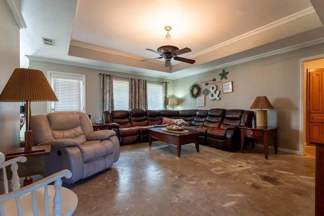 living room featuring a tray ceiling, a wealth of natural light, crown molding, and ceiling fan