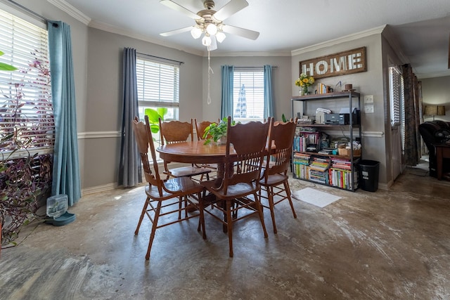 dining space featuring ceiling fan, concrete flooring, and ornamental molding