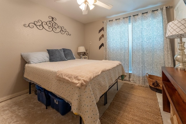 bedroom with ceiling fan and light carpet