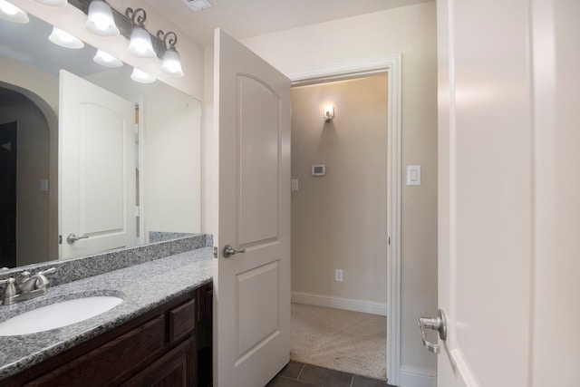 bathroom featuring tile patterned floors and vanity