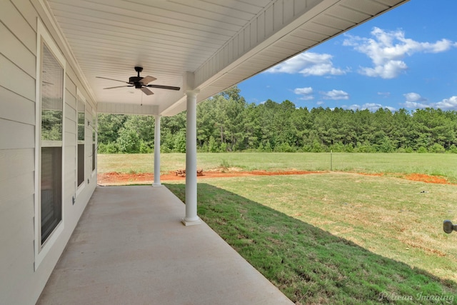 view of yard featuring ceiling fan