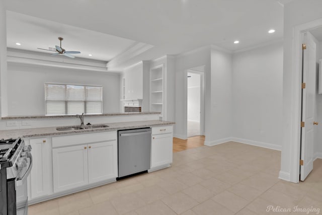 kitchen with ceiling fan, appliances with stainless steel finishes, white cabinets, light tile patterned floors, and sink