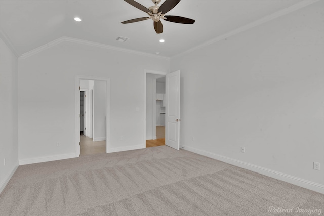 unfurnished bedroom with ceiling fan, crown molding, light carpet, and vaulted ceiling