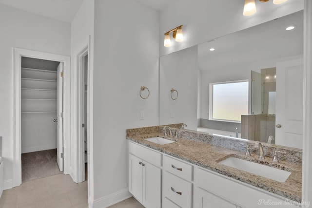 bathroom with dual bowl vanity and tile patterned flooring