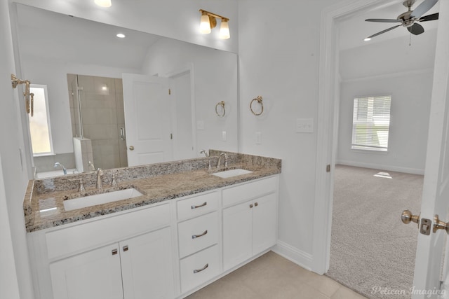 bathroom with double sink vanity, tile patterned floors, and ceiling fan