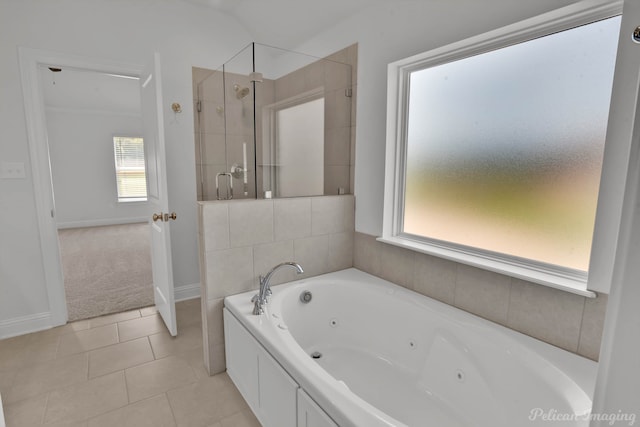 bathroom featuring tile patterned flooring and independent shower and bath