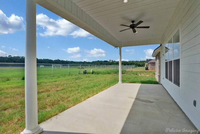 view of patio / terrace featuring ceiling fan and a rural view