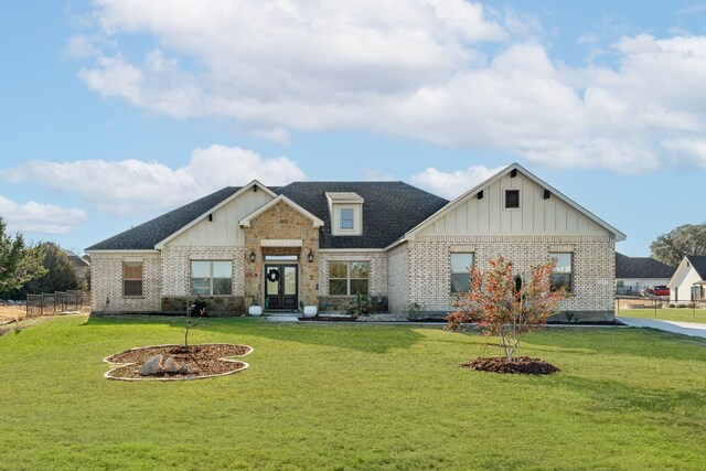 view of front of property with a front yard and a patio area