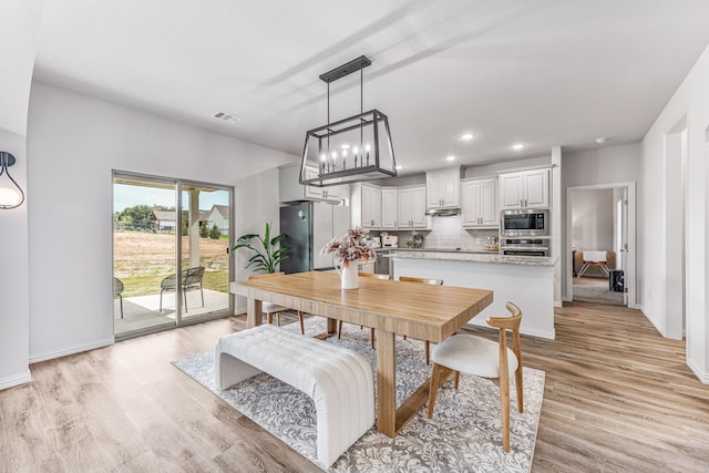 dining room featuring light hardwood / wood-style floors