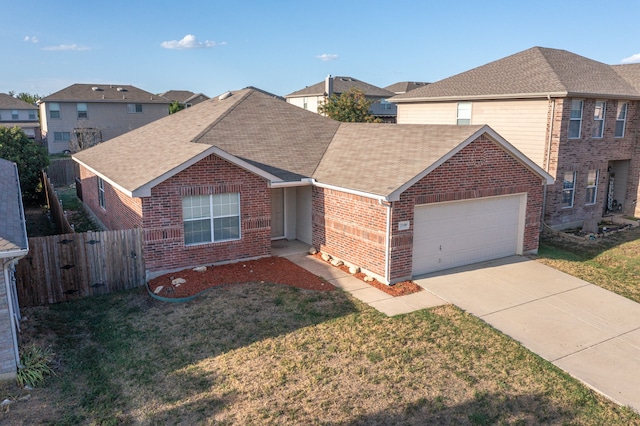 view of front of home featuring a garage and a front lawn